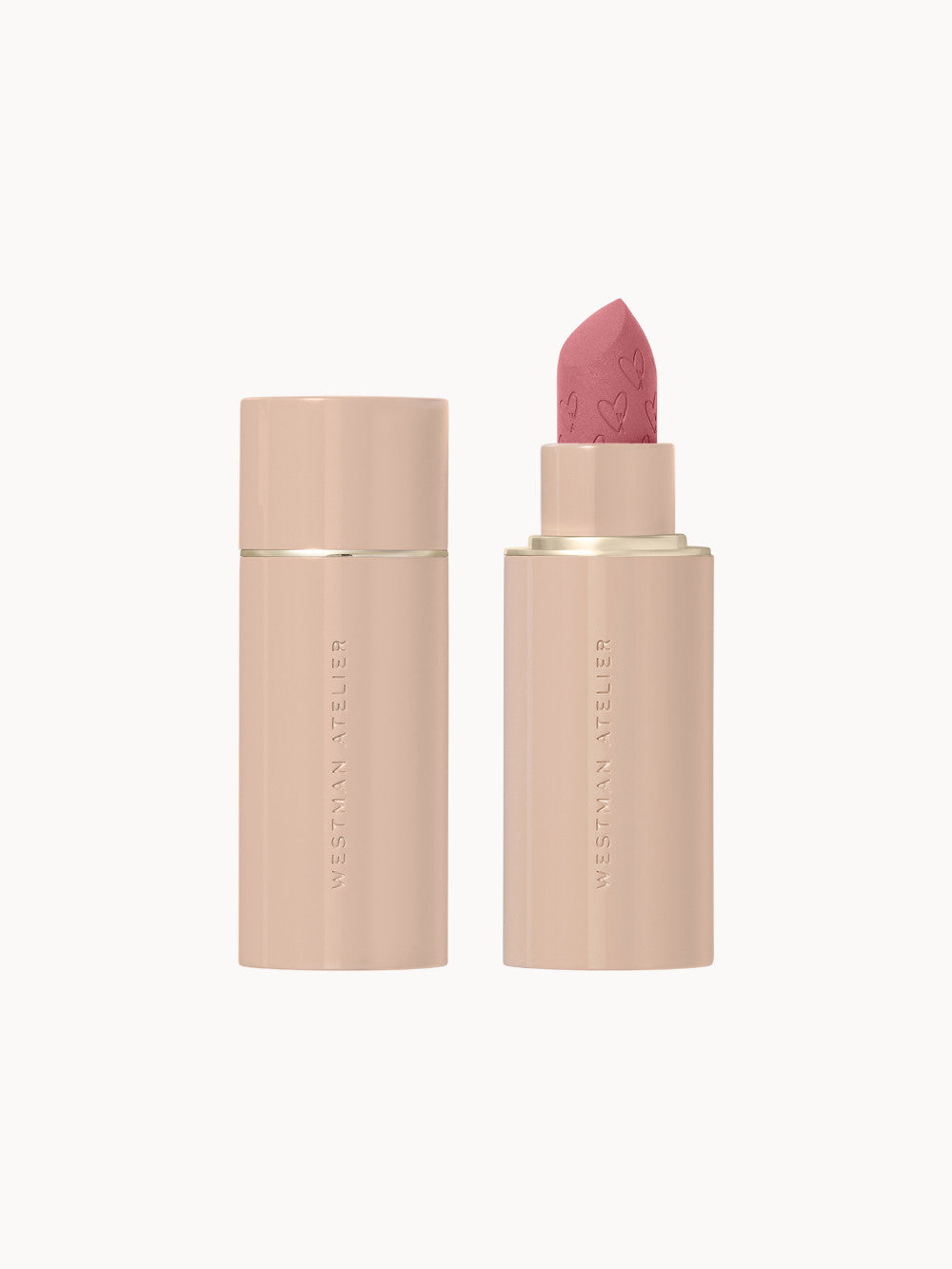 Westman Atelier Lip Suede Matte Lipstick – luxuriöser, matter Lippenstift in roséfarbener Hülse mit Herzprägung auf der Textur.