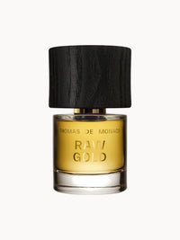 Flakon des Parfums Raw Gold Extrait de Parfum von Thomas de Monaco mit goldenem Duftinhalt und edlem, schwarzem Holzverschluss.