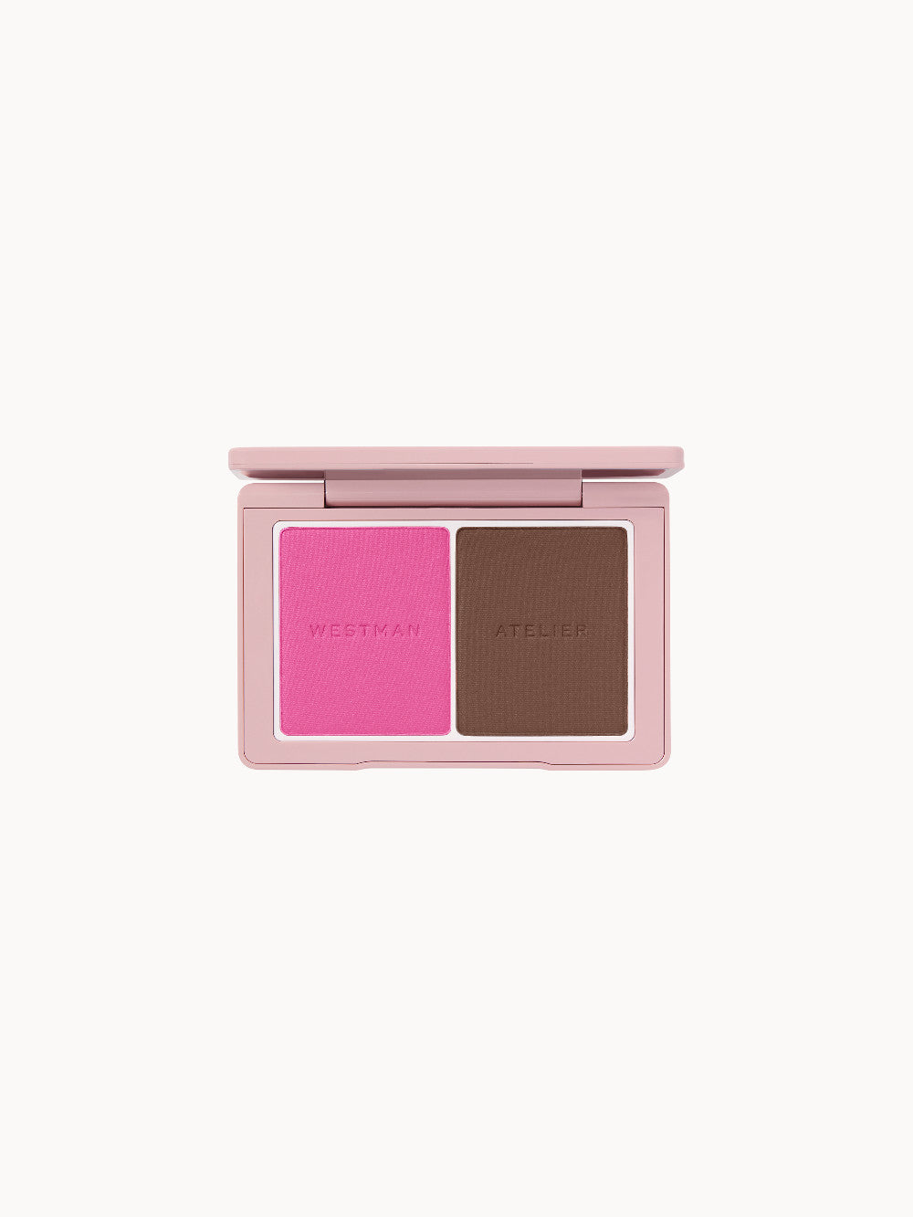  Offene Puderdose mit zwei Farbflächen: links ein kräftiges Pink, rechts ein mittleres Braun; Prägung „Westman Atelier“ auf beiden Farben.