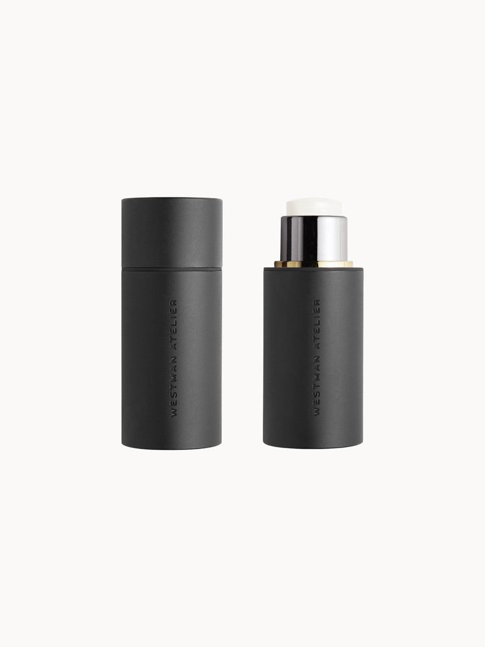 Schwarzer Highlighter-Stick von Westman Atelier, einmal mit geschlossenem Deckel und einmal geöffnet, zeigt die transparente Gel-Textur.
